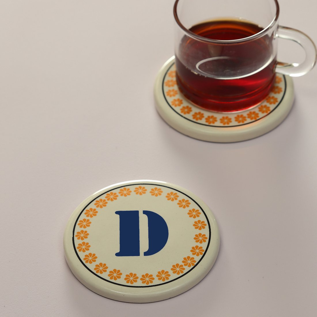 Monogram D coaster