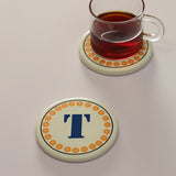 Monogram T coaster